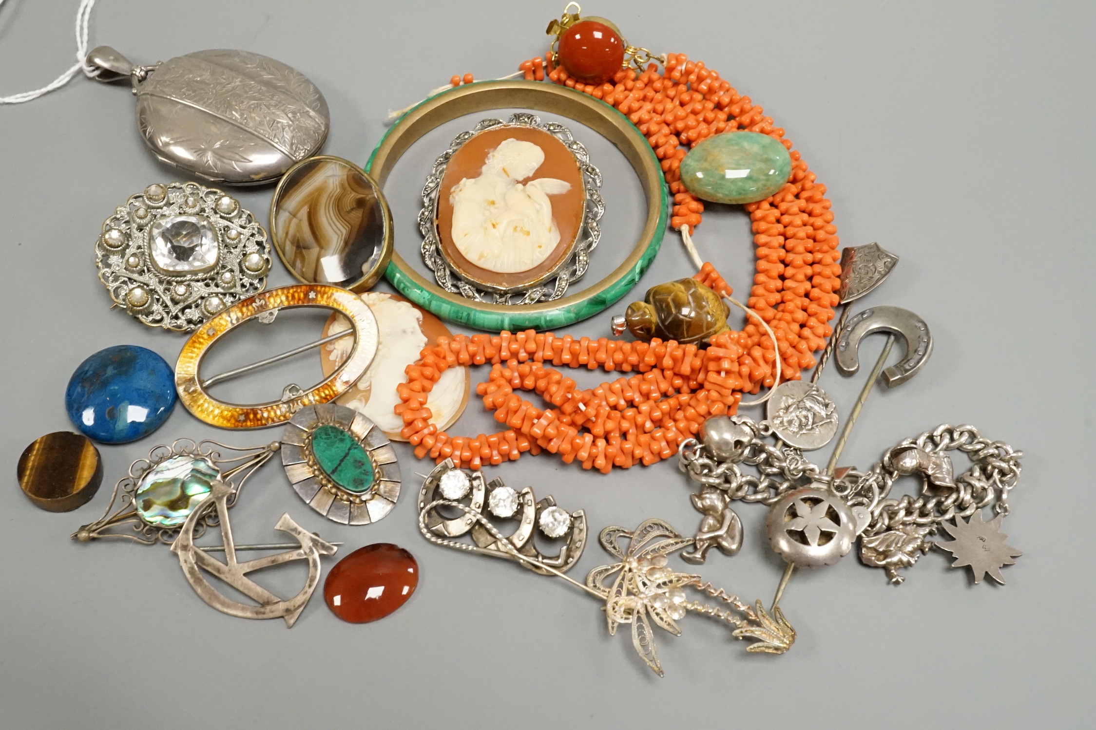 A Victorian silver oval locket and other jewellery including and coral necklace and white metal charm bracelet stamped 'silver, etc.